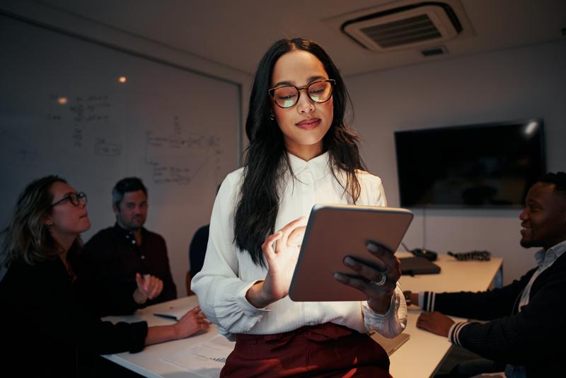 Businesswoman using digital tablet in meeting room