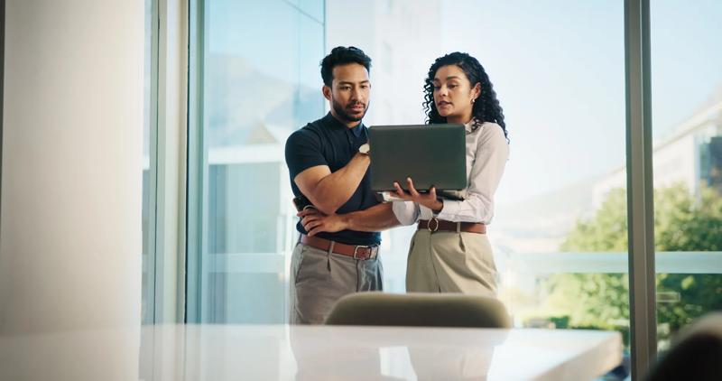 Business people, laptop and meeting with real estate team, discussion or available listings on website. Check, collaboration and property review for realtor group, strategy or client feedback on pc.