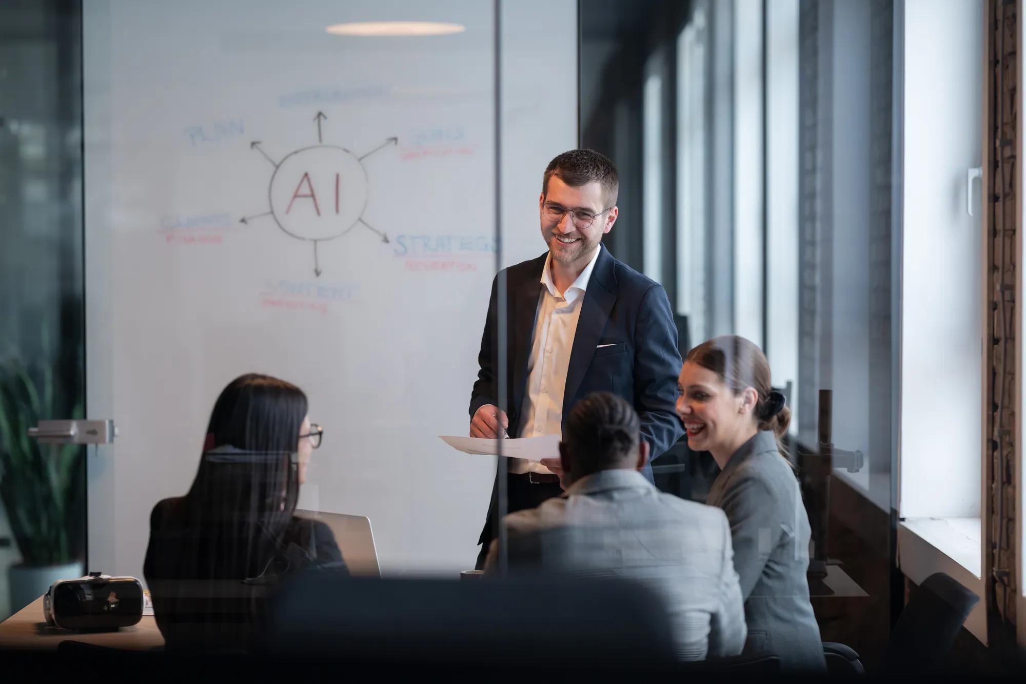 Diverse business team in a modern office during a meeting, discussing artificial intelligence strategy. Concept of AI innovation, teamwork, leadership, corporate planning, professional collaboration.