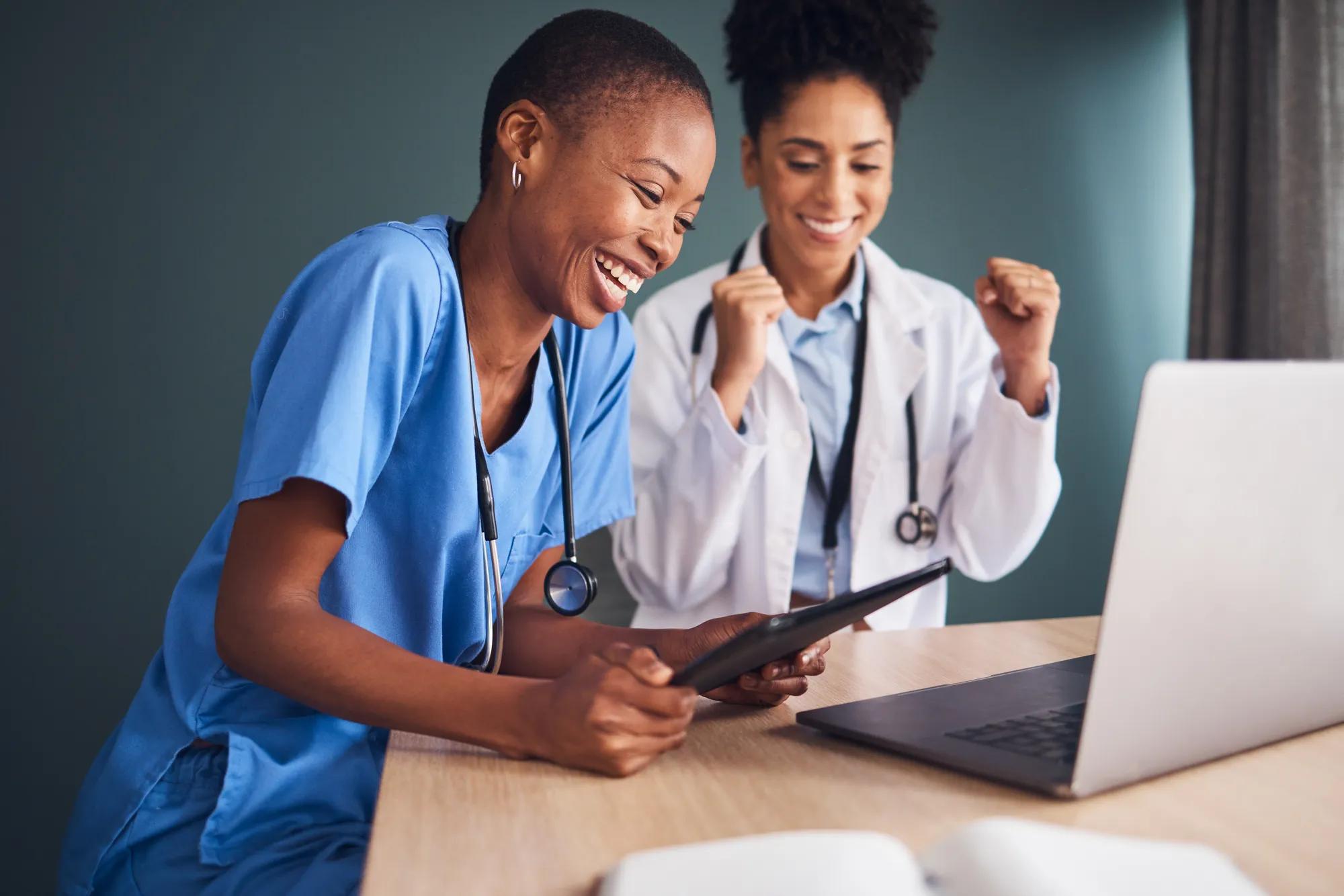 Employer reviewing pharmacy benefits strategy and healthcare costs with a benefits consultant during a planning discussion about pharmacy plan management and cost containment.