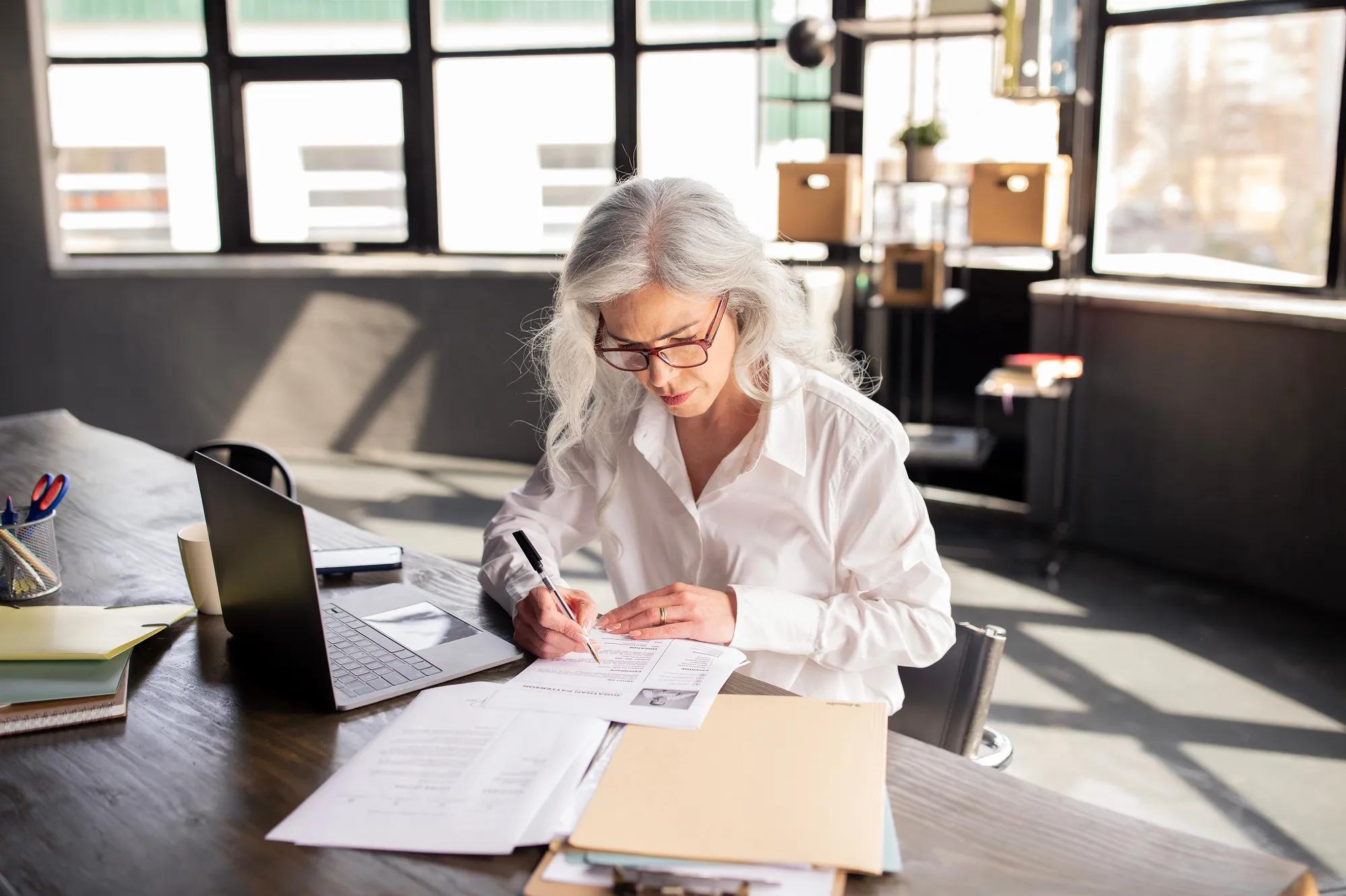 Employer compliance and benefits professionals reviewing mental health parity regulations, healthcare plan oversight, and compliance strategy during a workplace planning discussion.