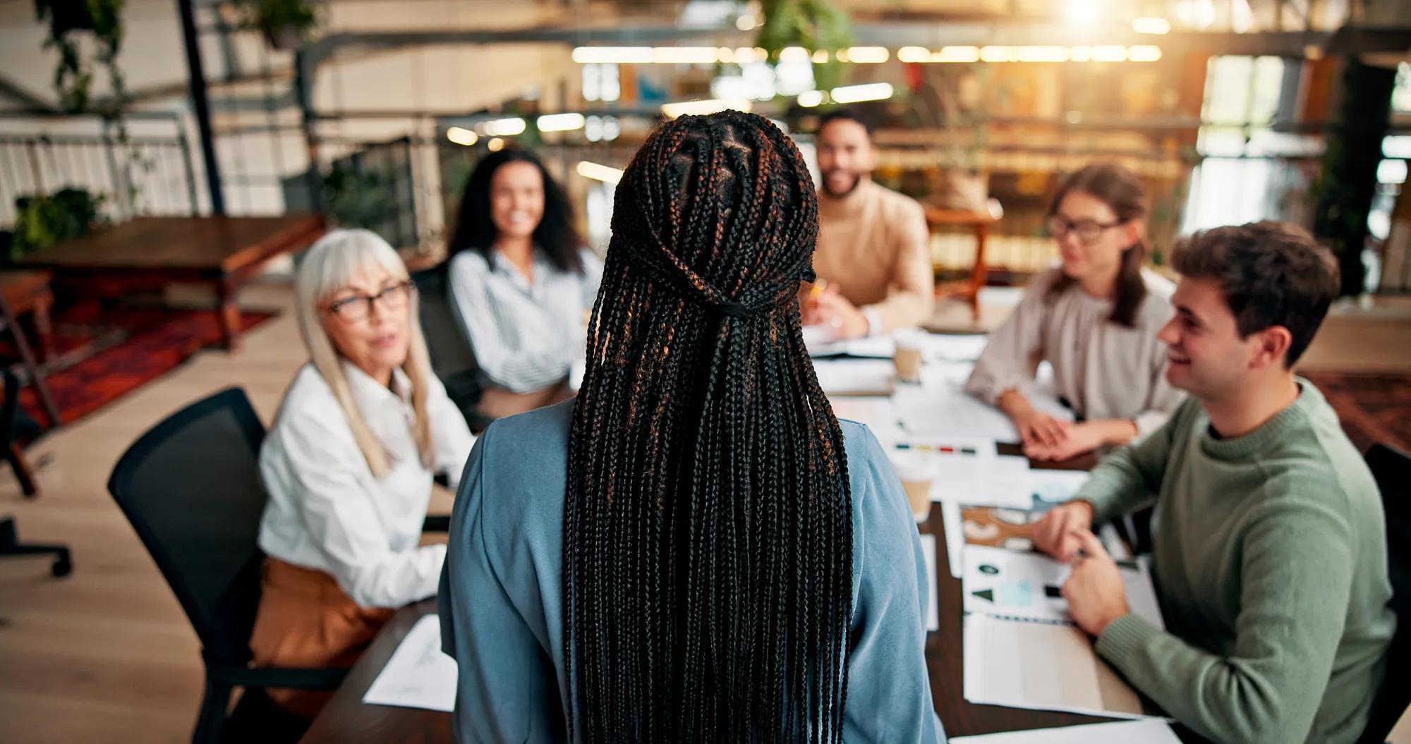 Brainstorming, speaker and woman in boardroom, teamwork and brand specialist with ideas for project. Business, back and people with strategy for target audience, trends and speech for workshop.