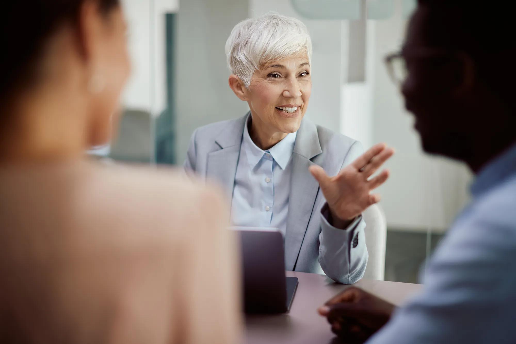 Business leaders reviewing global employee benefits data and multinational pooling strategy across multiple countries to improve governance, risk management, cost visibility, and financial efficiency.