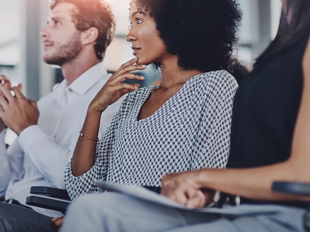 Education, development and seminar with business people at presentation for learning or training. Corporate, event or workshop with man and woman employee group in audience or crowd at office.
