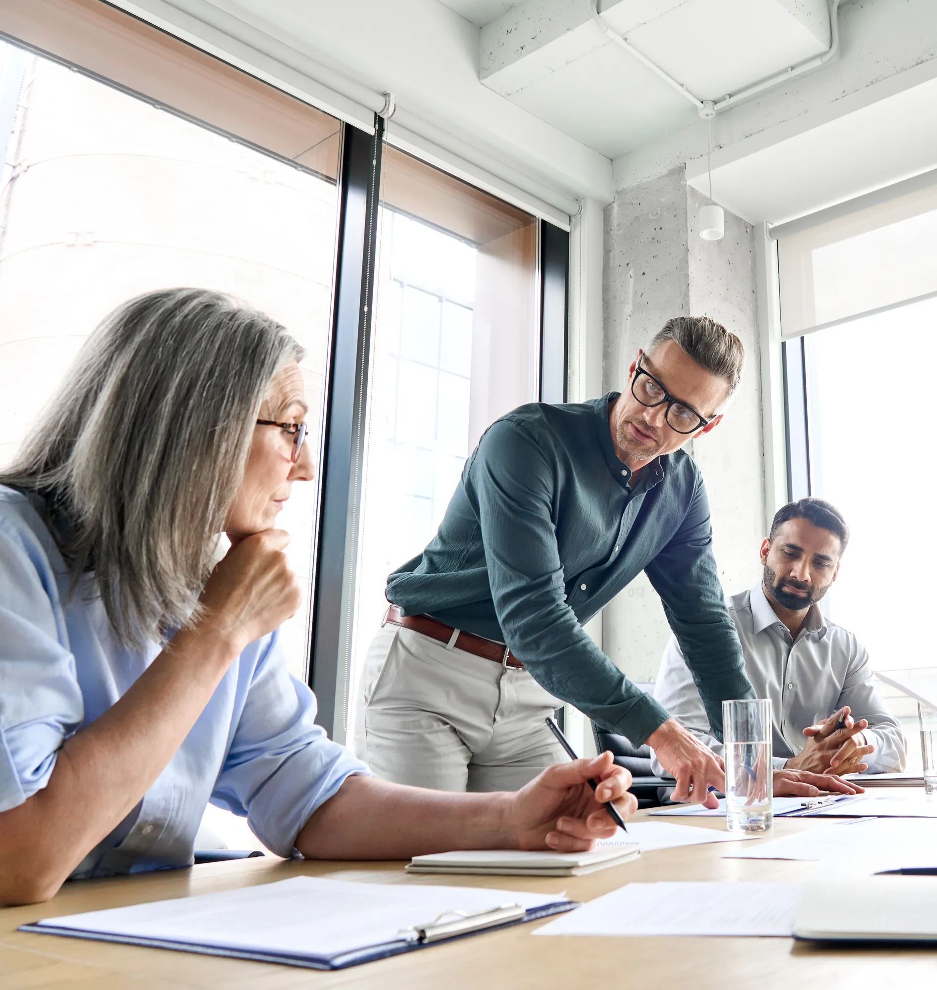 1 female and 2 males in a meeting