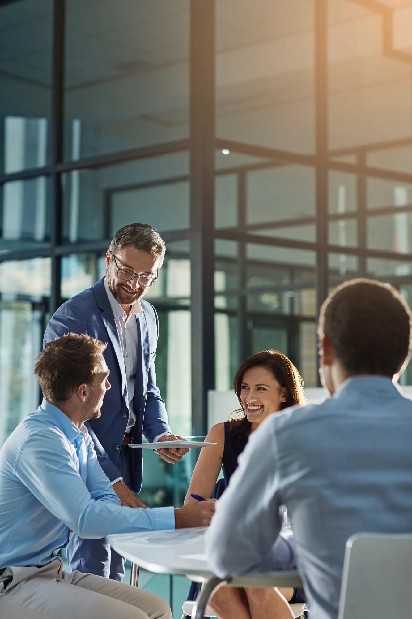 Leadership, manager and mature man with team meeting, planning and happy management in corporate business. Success, teamwork and communication of people, employees or staff executive in collaboration.