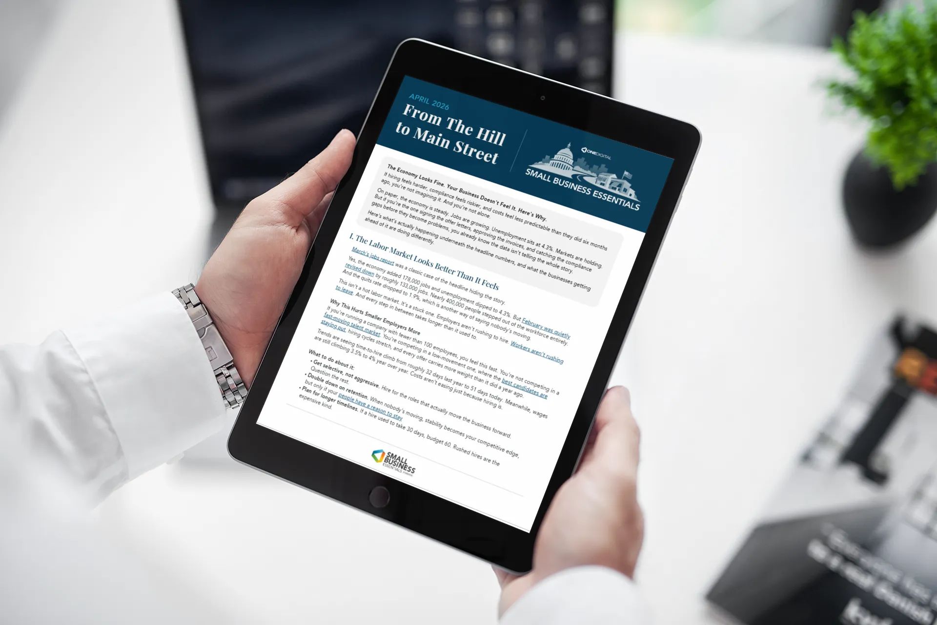 Man holding iPad reading document