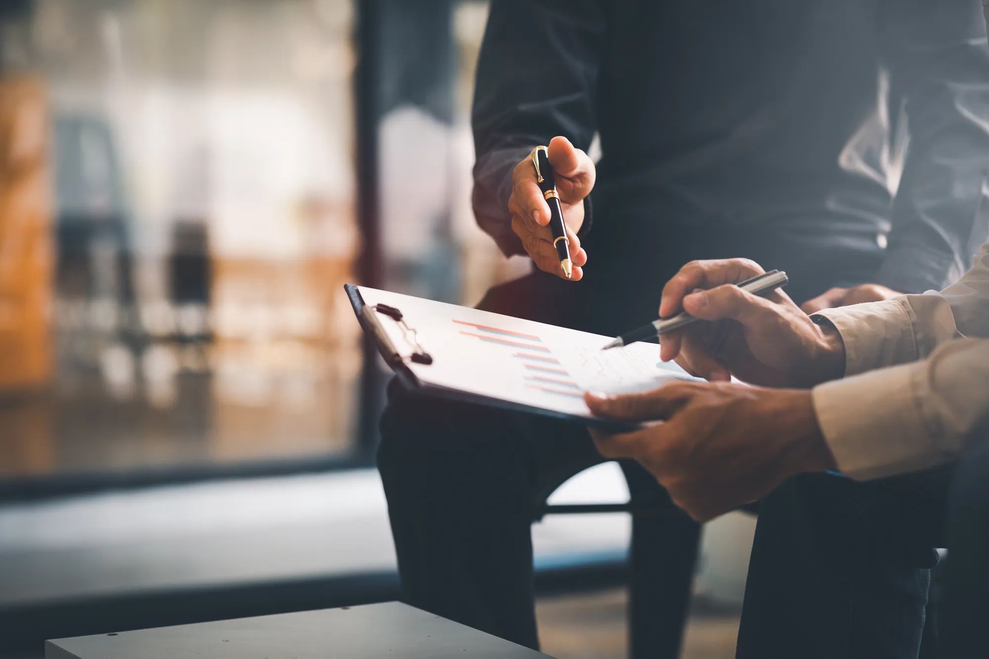 Team of Business collaboration discussing working analyzing with financial data and marketing growth report graph in team, presentation and brainstorming to strategy planning making profit of company