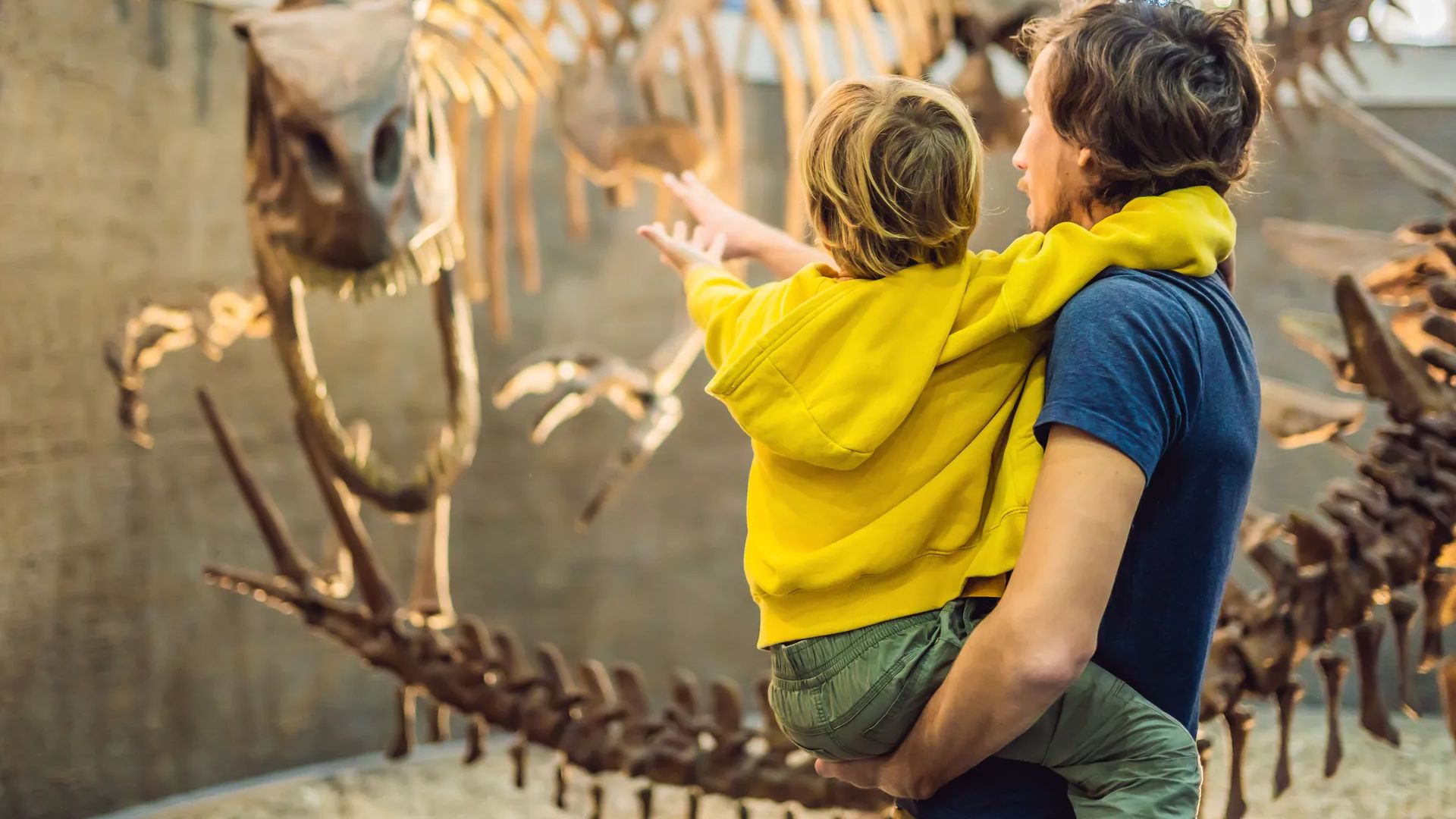 Parent and Child at History Museum with Fossils