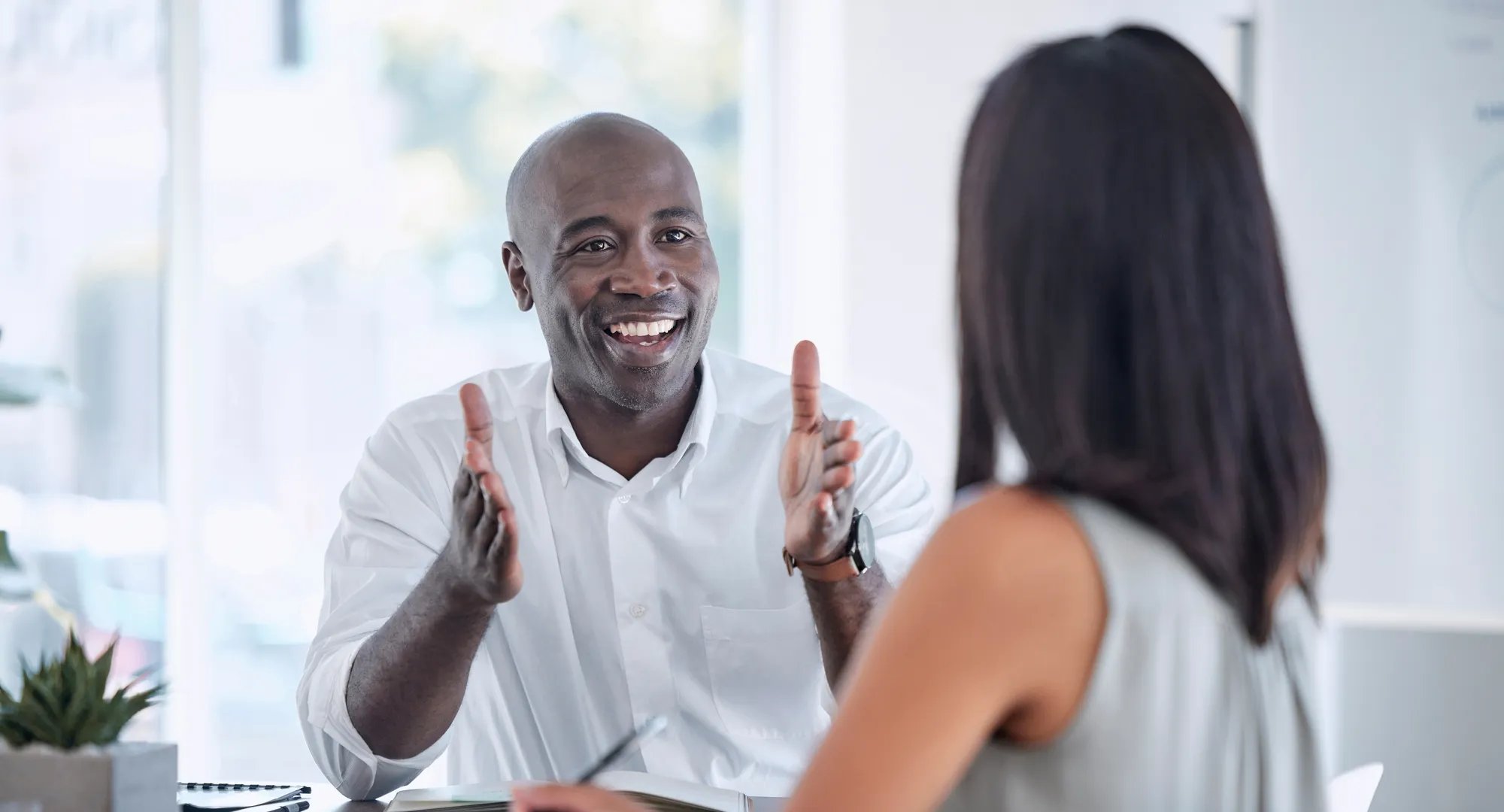 Collaboration, teamwork and business people meeting for kpi review, project development update and office b2b communication. Corporate black man talking to woman client or employee on job negotiation.