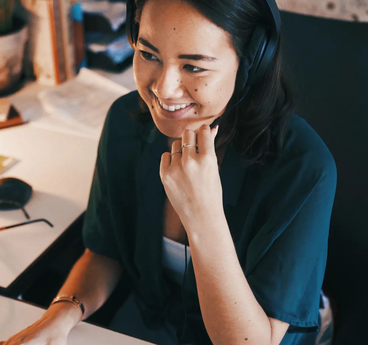 Customer support, headset and remote work with business woman in home office for assistance at night. Computer, contact and help with Asian freelancer in dark apartment for communication or feedback.