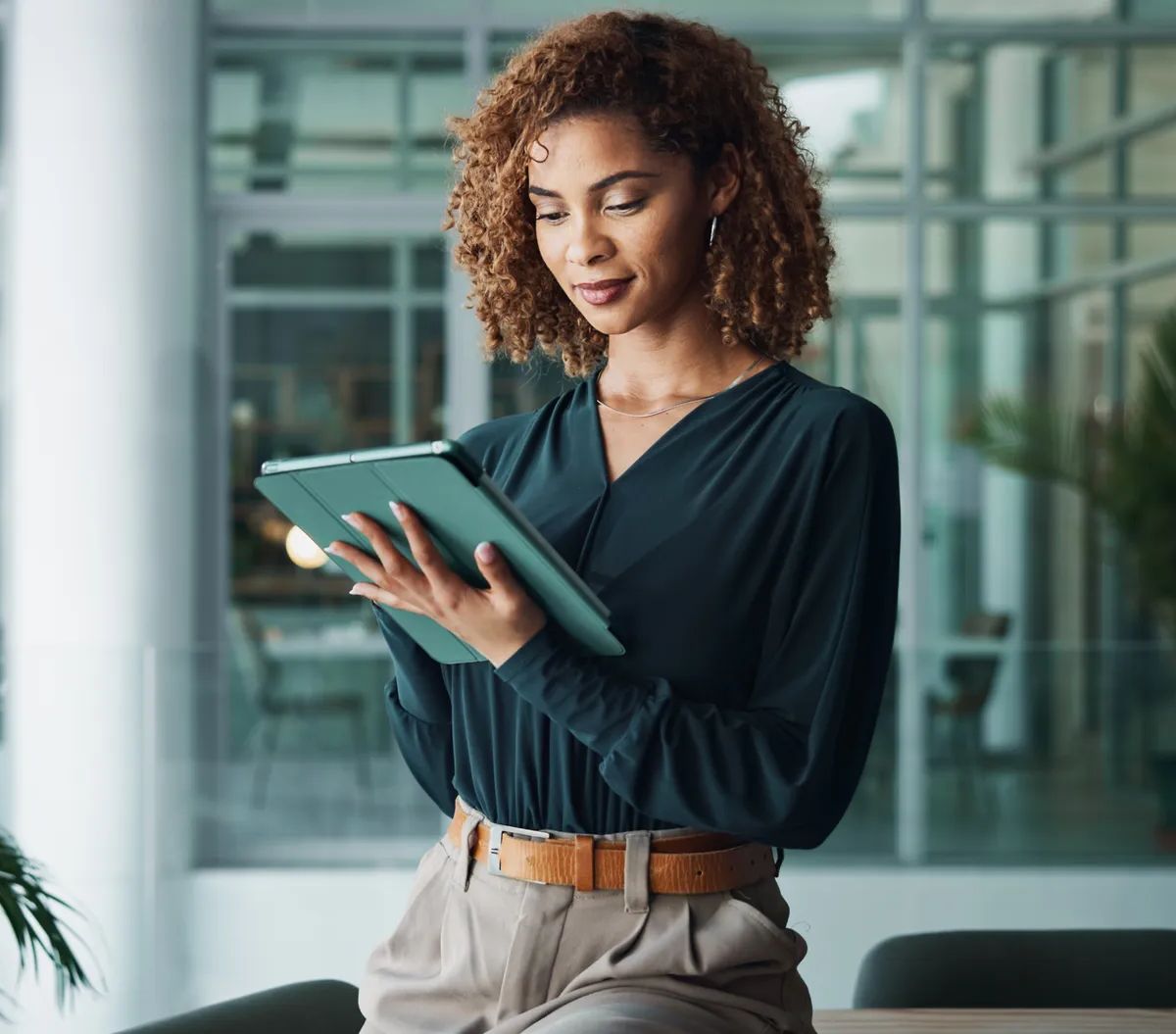 Tablet, creative woman and hands with communication, research or reading news for publishing in startup office. Digital technology, manager and planning business project, review and problem solving.