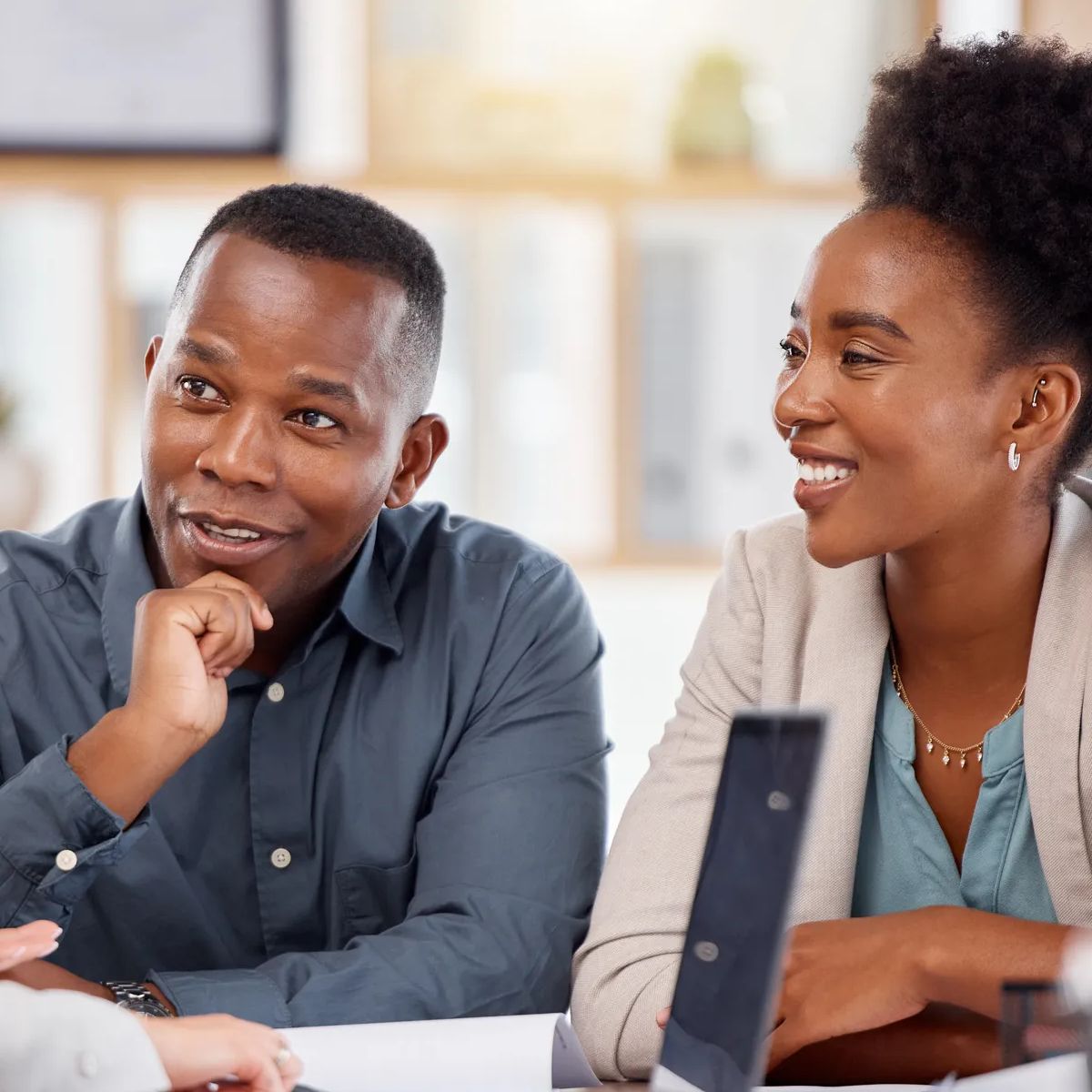 Black couple, financial advisor and investment planning meeting with bank documents and contract. Accounting, savings and budget consulting with banking management woman talking about payment.
