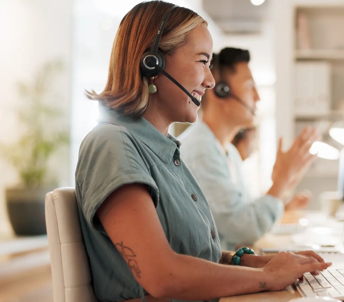 Call center, consulting and laughing with woman in office for contact us, communication and customer service. Salesman, help desk and technical support with person in crm agency for telemarketing.