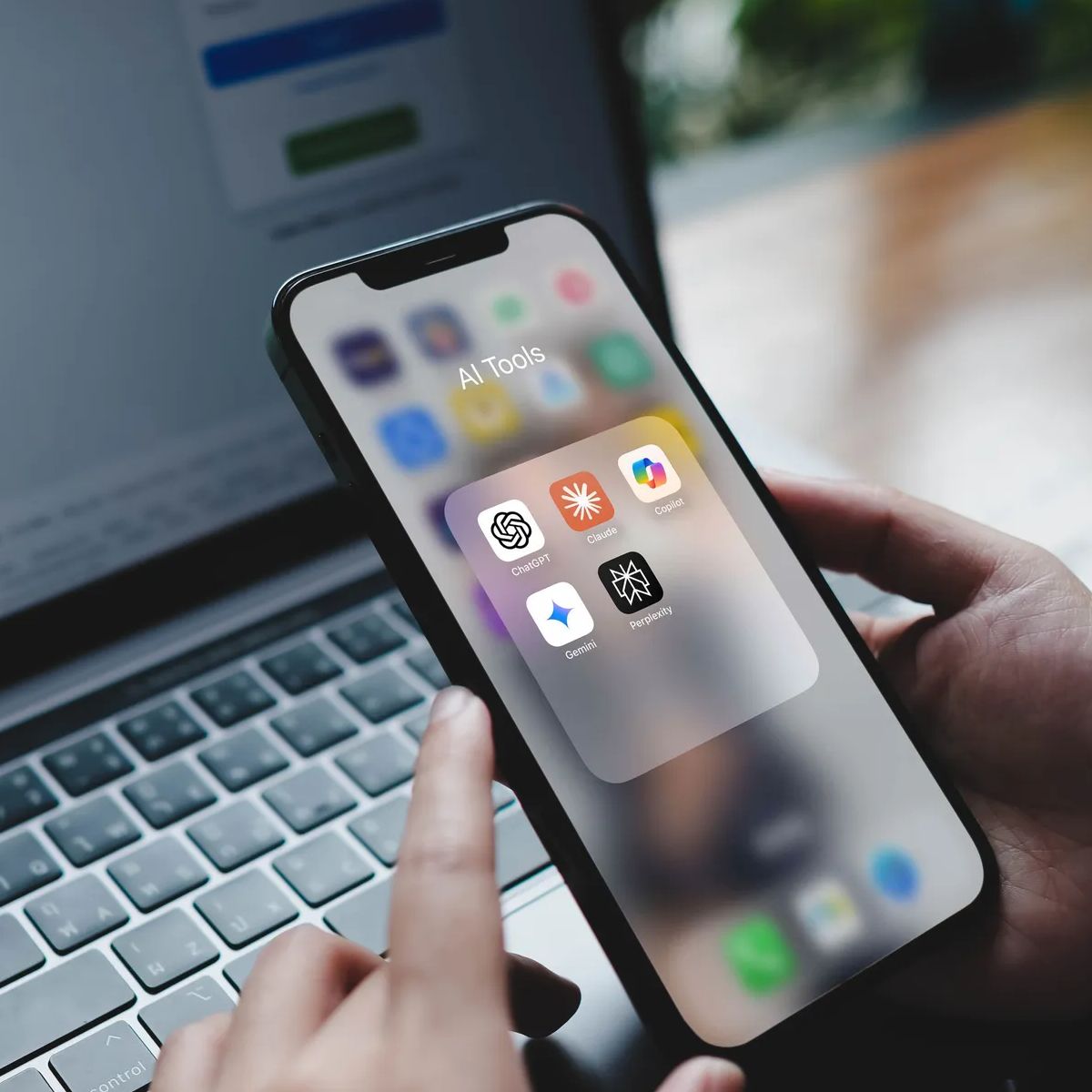 Bangkok, Thailand. August 23, 2025; A person opening a folder of popular AI tools on a smartphone, including ChatGPT, Gemini, Midjourney, and Perplexity.