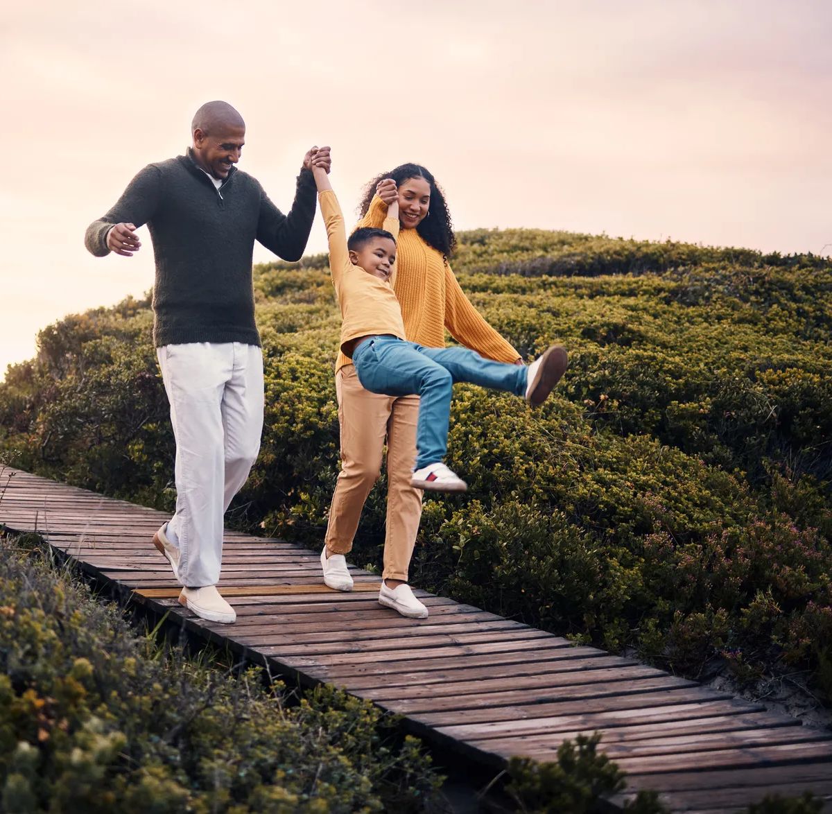 Family, walking or sunset with parents, kids and grandparents playing together outdoor in nature. Spring, love or environment with children and senior relatives taking a walk while bonding.