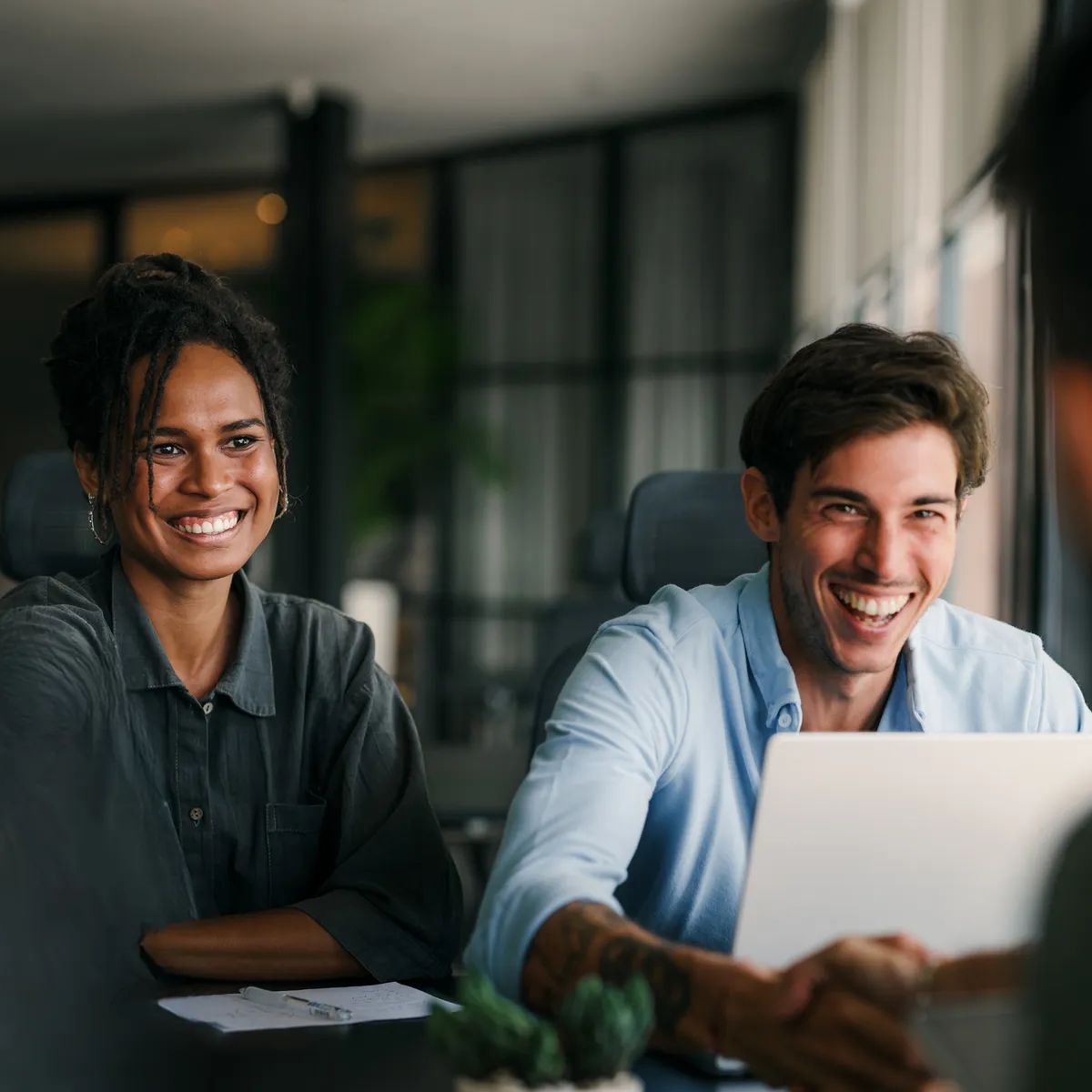 Multicultural Professional Businesspeople Working Together on Research Plan in Boardroom. - Edited (3)