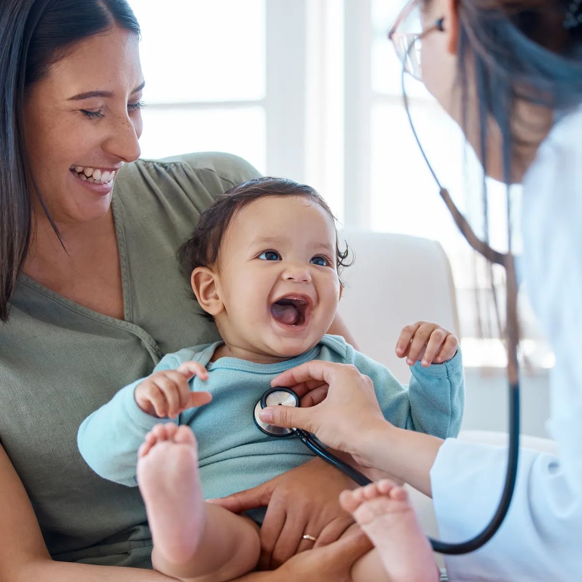 Mother, baby and stethoscope of pediatrician for healthcare consulting, check lungs and breathing for heartbeat. Doctor, happy infant kid and chest assessment in clinic, hospital and medical analysis.