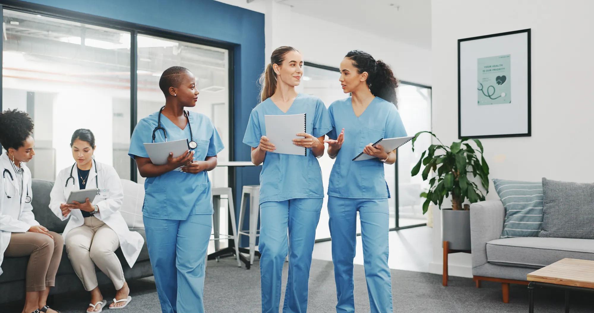 Talking nurses, walking and documents in hospital teamwork, diversity collaboration or bonding on surgery or clinic break. Smile, happy and healthcare women with medical research, paper or funny joke.