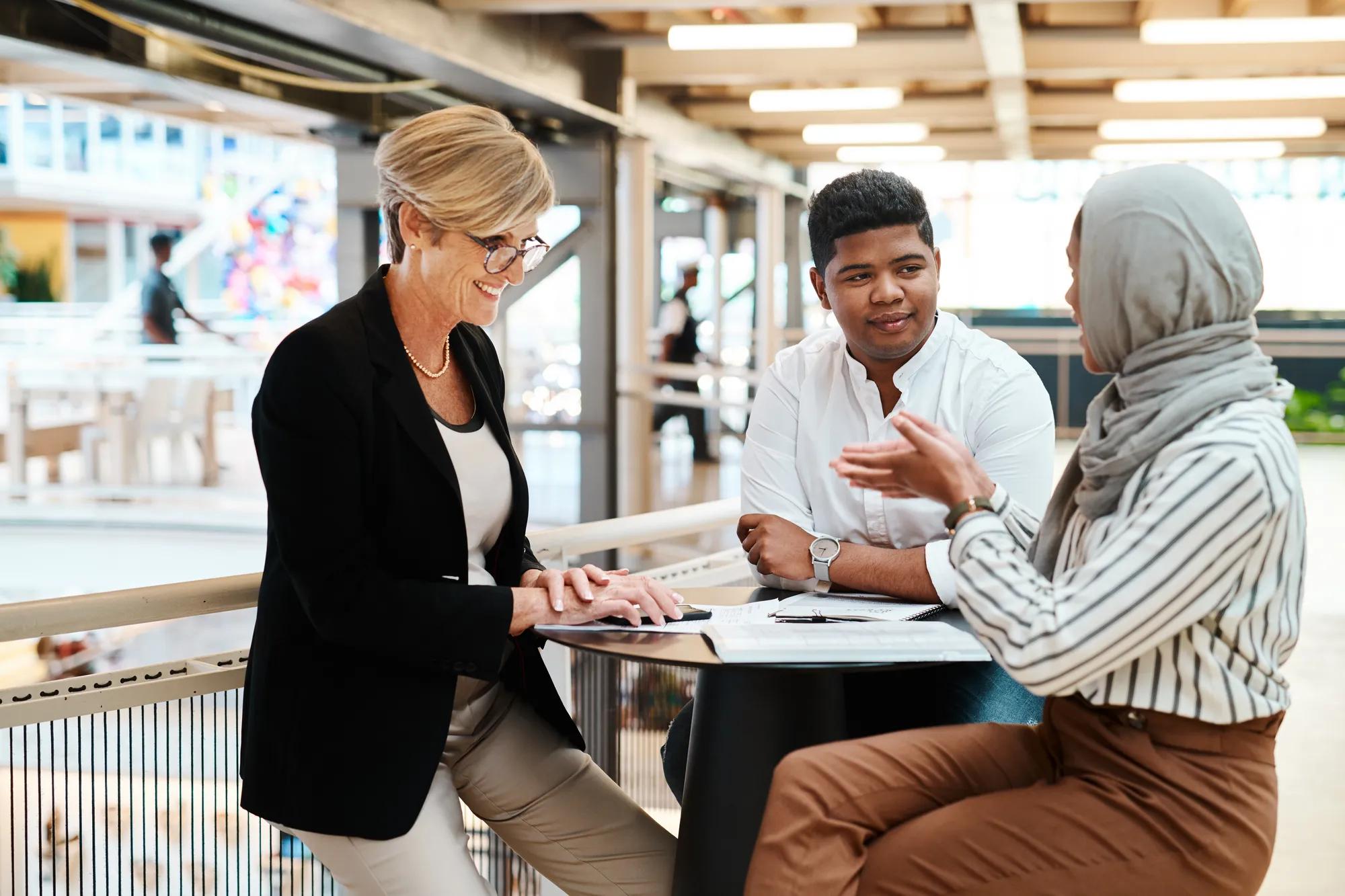 Shot of a group of businesspeople having a discussion in an office.