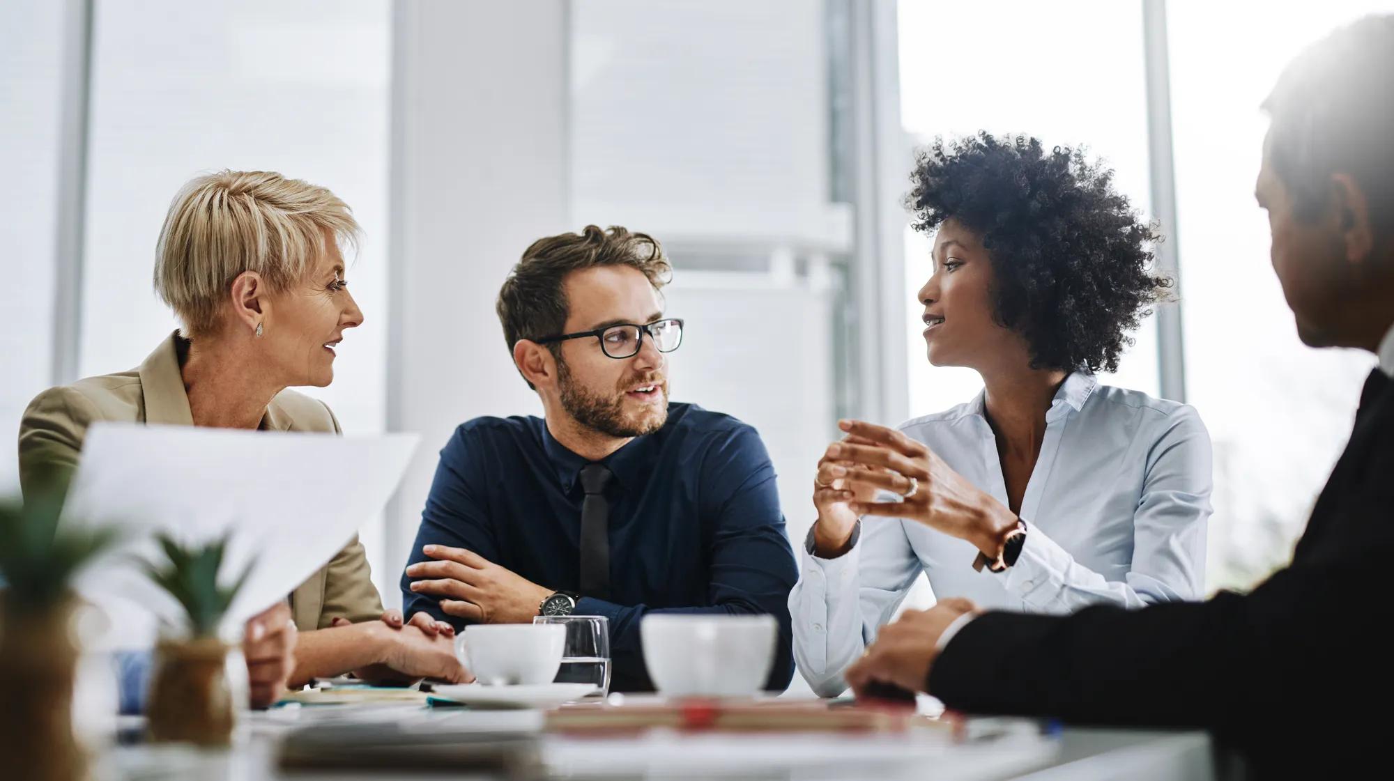 Shot of a group of businesspeople sitting together in a meeting