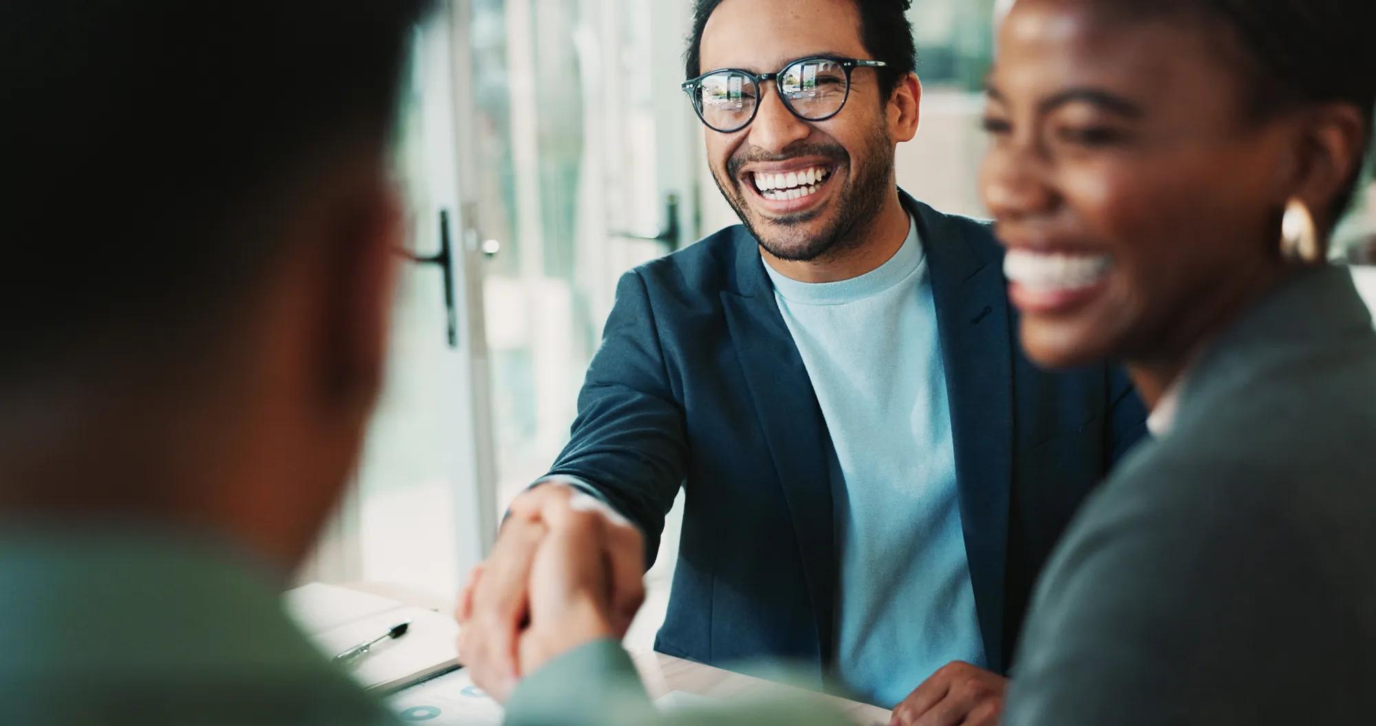 Business, people and handshake with welcome in office for b2b upsell opportunity and contract agreement success. Internal collaboration, happy account manager and shaking hands for client onboarding.