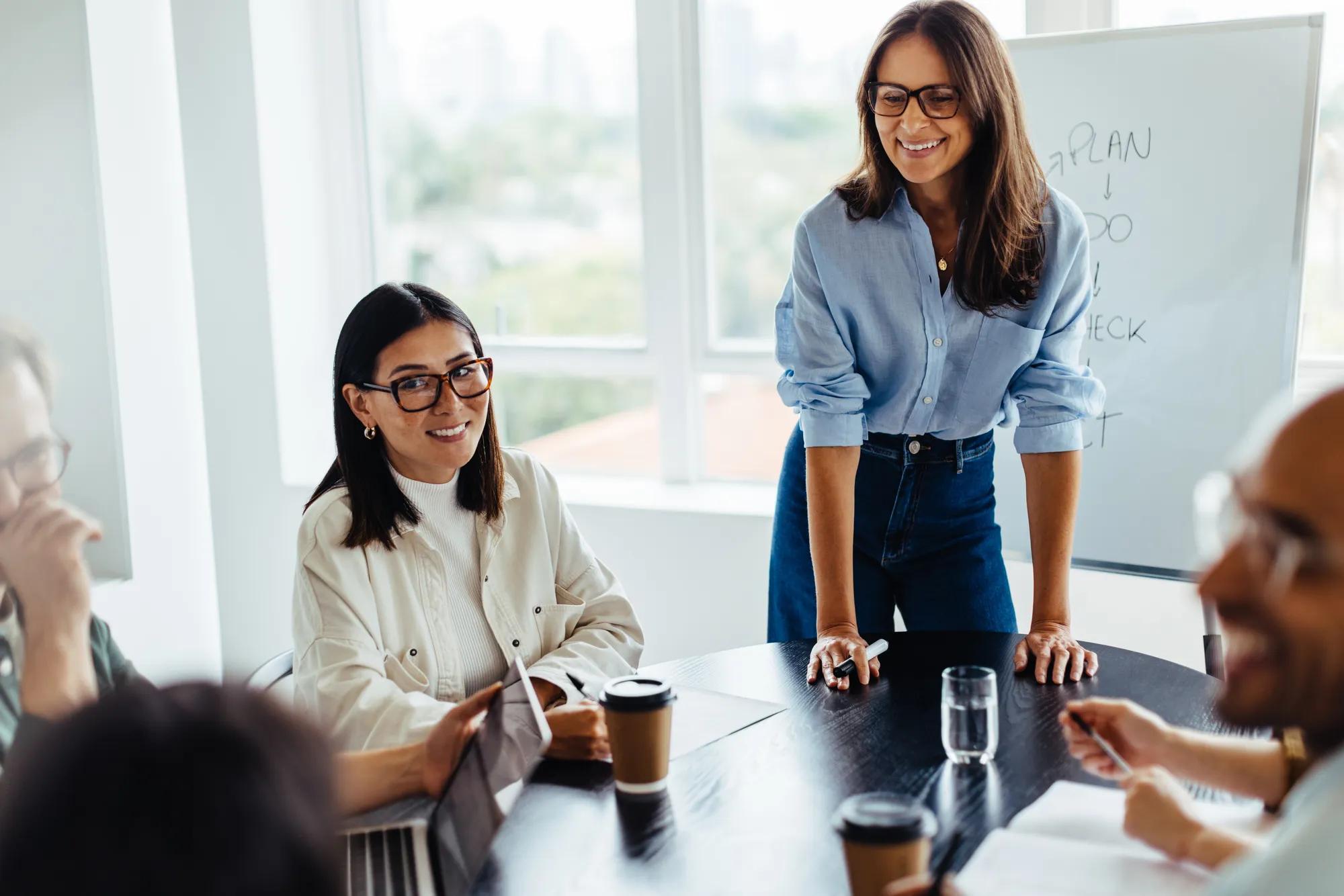 Professionals analyzing healthcare costs and employee benefits strategy with a broker to improve cost control, compliance, and workforce performance.